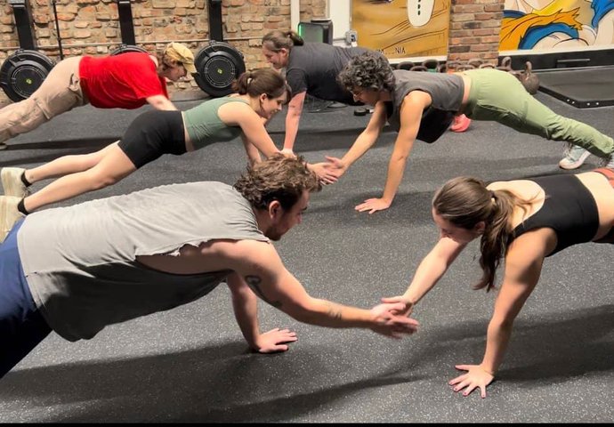 Group performing synchronized push-ups